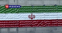 آیین رونمایی از پرچم ایران مزین به یاد شهدا